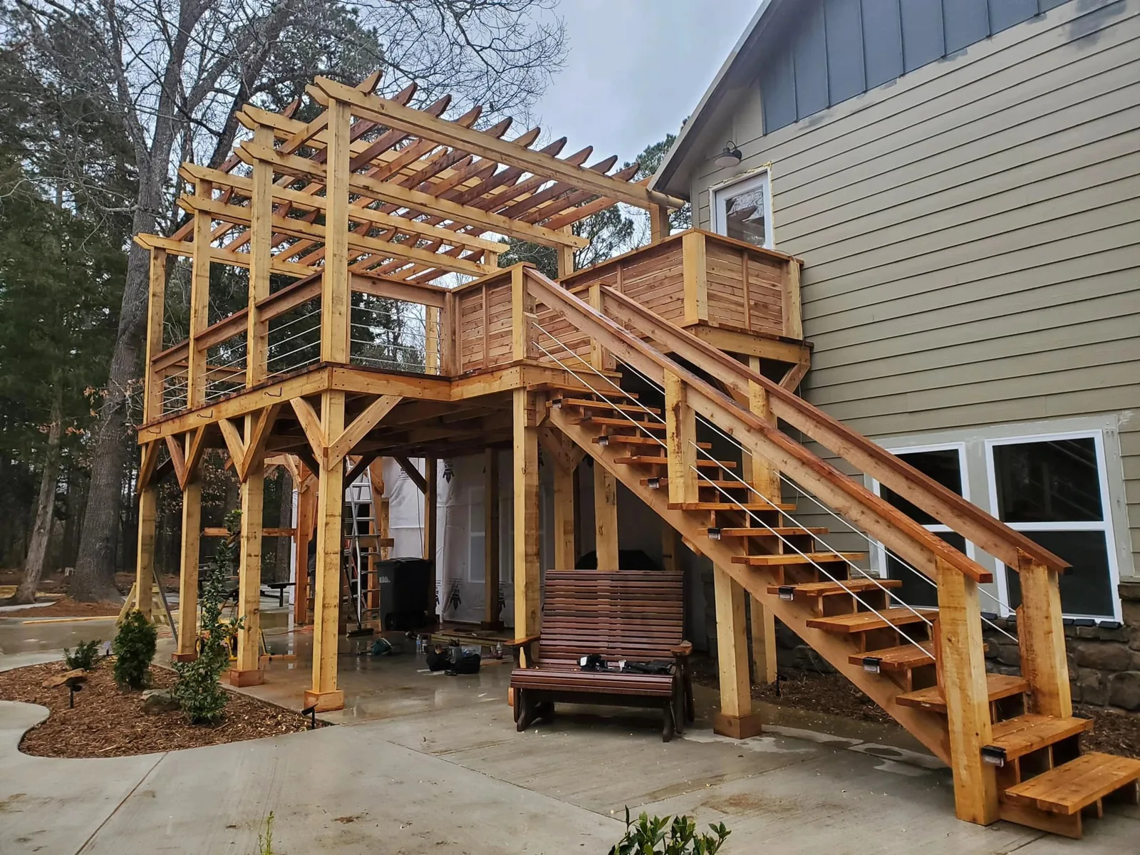 Raised wood deck with pergola, railing and stairs from the company project gallery